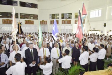 Opposition Leader David Granger, Prime Minister Samuel Hinds, President Donald Ramotar, Education Minister Priya Manickchand, Social Services Minister Jennifer Webster, Public Works Minister Robeson Benn and alumni of  Queen’s College being saluted at Queen’s College’s 170th Anniversary celebration. (GINA photo)
