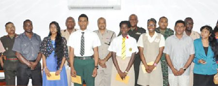 Joint Services students awardees, at front from left  Ramnauth, DeMendonca, Gaskin and Williams and their parents, with Chairman of the Joint Services, other Heads of Service and Senior Officers of the GDF.