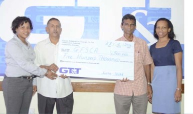 Ramchand Ragbeer, President of the Guyana Floodlight Softball Cricket Association,  (second from left)  receives the  sponsorship cheque from GT&T Marketing Officer Nicola Duggan (extreme left)  in the presence of GT&T’s Marketing Officer Margaret Washington and GFSCA’s Daram Persaud. 