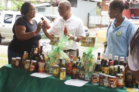 Passing through: Agriculture Minister Dr Leslie Ramsammy at the GGMC Street Fair on Saturday