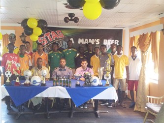 GFA President Vernon Burnette (sitting centre) along with GFA Vice President of Competitions Frank Parris (sitting left) and Stag Beer Brand Manager John Maikoo (sitting right) is flanked by members of the competing clubs during the launch of the GFA Stag Beer Futsal Championship yesterday.  