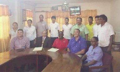 CAC-bound athletes and officials pose for a photo opportunity with president of the GOA, K Juman Yassin (sitting second from left) following yesterday’s press briefing. 