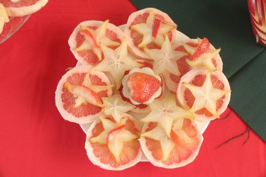 Fruit décor by 5A students comprising strawberries, carambola and citrus slices.