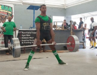 Vijai Rahim dead lifting a new national record yesterday. (Orlando Charles photo) 