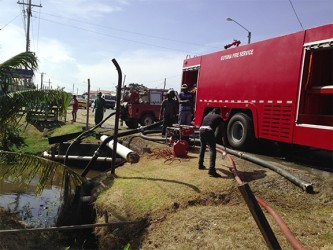 Fire tenders accessing water from the trench