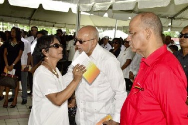 Widow, Indranie Chandarpal greeting President Donald Ramotar and Home Affairs Minister Clement Rohee at her husband’s funeral. (GINA photo) 