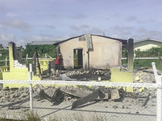 The razed remains of the Bacchuses’ home following Friday’s fire