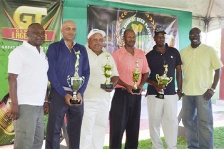 The champion Patanjalee “Pur” Persaud (second left) with other winners Vijay Deo, Sunil Lauton and Jaipaul Suknanan flanked by Banks DIH Communications Manager Troy Peters and Lindel Harlequin (Senior Manager – Credit and Marketing) of Citizens Bank.