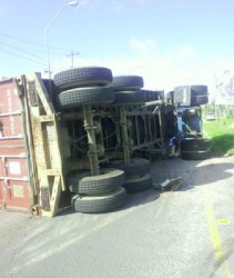 The freight truck on its side at the Houston intersection yesterday  afternoon.