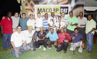The group picture shows Macorp representatives, including Macorp General Manager Jorge Medina, the nine golfers who received prizes and Club President David Mohamad. 