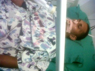 An unconscious Anthony Narine at the Woodlands Hospital before he died yesterday. 