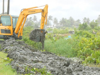 The excavator when it was used earlier in the year to clear the canals along Republic Road, New Amsterdam. 