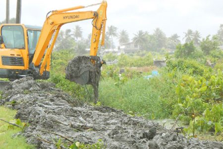 The excavator when it was used earlier in the year to clear the canals along Republic Road, New Amsterdam.