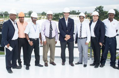 Prime Minister Sam Hinds (fourth from left) and Mauricio Nicholls (fifth from left) with other officials