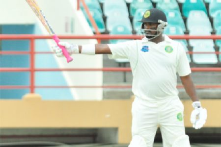 Narsingh Deonarine calmly raises his bat to acknowledge a well-played half-century
