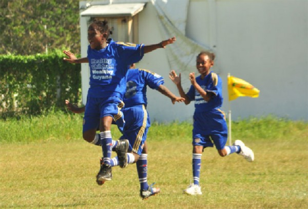 Enterprise Primary’s Aaliyah Elaine celebrates scoring her first goal of two goals during her team’s match against St. Pius Primary.  