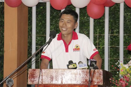 Jason Wang addresses invitees at the opening ceremony of his Real Value Supermarket.