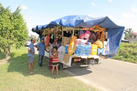 With customers in mind: A mobile variety store serving customers in Canal Number Two, West Demerara. The truck which drives through various communities touting its wares sells groceries, water and small haberdashery items. (Photo by Arian Browne)