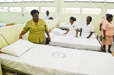 Georgetown Public Hospital Corporation’s Staff examining the beds at the unit (GINA photo)