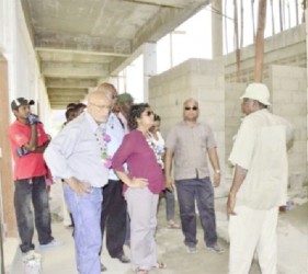 President Donald Ramotar (left), Education Minister Priya Manickchand (second from left) and others inspecting the building (GINA photo) 