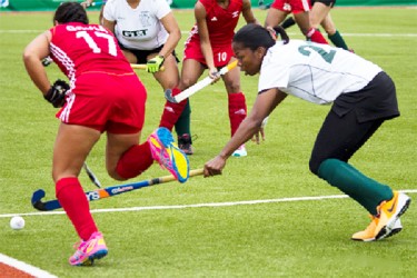 Guyanese custodian Alysa Xavier denying Trinidad and Tobago’s Blair Wynne (no.3) during their side’s 0-0 stalemate 