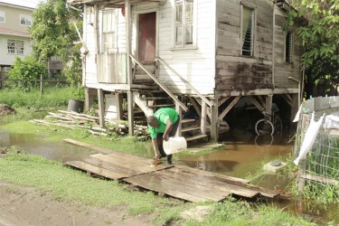 A resident cleaning up after flooding yesterday.  