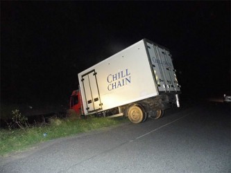 The driver of this truck got fed up waiting in the line for the Berbice Bridge to reopen on Saturday night and opted to turn around. However, the poorly lit road proved difficult for him to manoeuvre and he ended up in the ditch. The bridge had failed to close around 5 pm following a scheduled opening. 