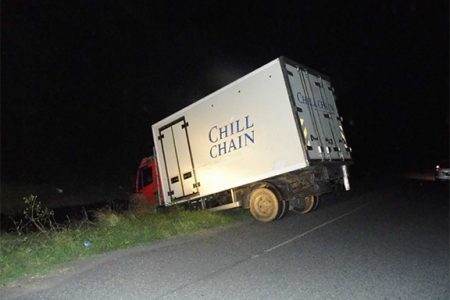 The driver of this truck got fed up waiting in the line for the Berbice Bridge to reopen on Saturday night and opted to turn around. However, the poorly lit road proved difficult for him to manoeuvre and he ended up in the ditch. The bridge had failed to close around 5 pm following a scheduled opening.
