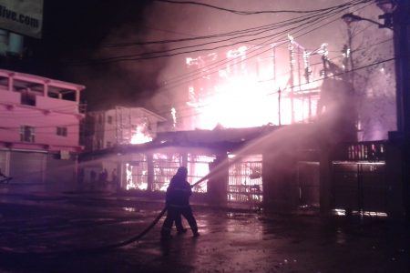 The Robb and King streets building engulfed in flames this morning. Firemen could be seen directing a hose at the fire.