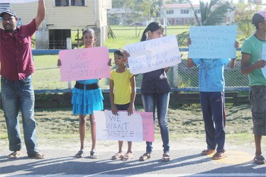 The man’s Children in the Centre of the Photo along with other protestors from left to right Shaneeza, Shalleeza, Nareefa. 