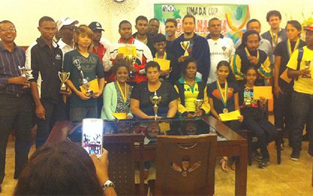 Successful participants at the end of the FIDE/ GCF Umada Cup display their trophies