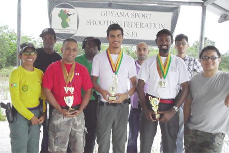 Prize Winners (with trophies) from left to right, Ray Beharry, Pravesh Harry and Ryan McKinnon, with other participants.