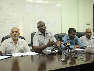 Minister of Transport Robeson Benn flanked by CJIA CEO Ramesh Ghir on his left and Director of GCAA Zulficar Mohammed on his right.  At right is Permanent Secretary, Balraj Balram.