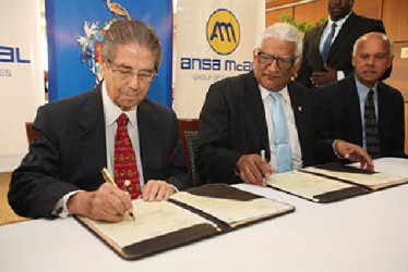University of the West Indies St Augustine (UWI) campus principal Professor Clement Sankat, centre, looks on as Dr Anthony N Sabga, left, chairman emeritus of the ANSA McAL Group signs the memorandum of understanding (MOU) between UWI and ANSA McAL for the establishment and construction of the Anthony N Sabga School of Entrepreneurship and Guardian Media School of Journalism at the group’s head office on Maraval Road, Port-of-Spain. At right is Grenfell Kissoon, chairman of Guardian Media limited. 