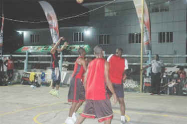 Shelroy Thomas of Colts-B in the process of netting a two-point dagger during his side’s win over Slash in the Mackeson 3x3 Basketball Challenge at the Alberttown Basketball Court. 