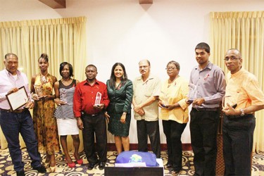 The awardees with NAPS Director Dr Shanti Singh (centre) and Minister of Health Dr Bheri Ramsaran (fourth, right).  