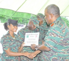 In this GDF photo Lyte receives her certificate from Brigadier Phillips. (GDF photo)