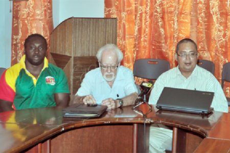 Patron of the GRFU, Kit Nascimento (centre) makes a point as Theo Henry (left) and president of the union, Peter Green look on. (Orlando Charles photo)
