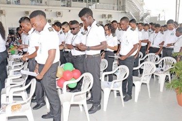 Some of the graduates yesterday reciting the mechanics creed. (Photo by Arian Browne)