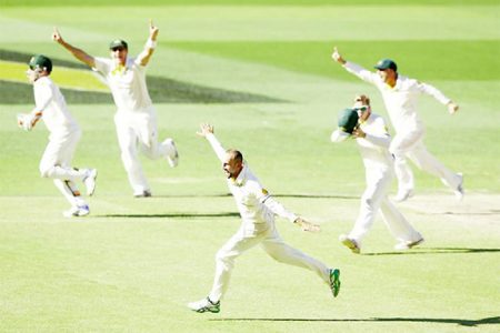 Nathan Lyon sets off in celebration after sealing Australia’s win
