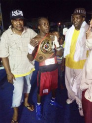 Newly-crowned national super bantamweight champion, Richard Williamson poses with his accolade along with the card’s promoter, Mark Thom and his trainer following the title fight versus Dillon Allicock on Saturday. 