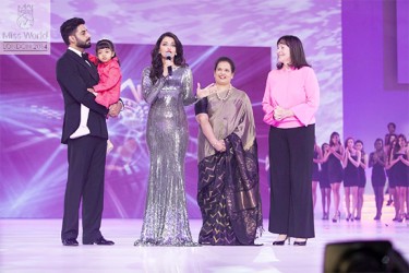 Miss World 1994, Bollywood royalty Aishwarya Rai Bachchan (centre) speaking at the contest yesterday. Her husband Abishek Bachchan is at left with their daughter. (Miss World photo)