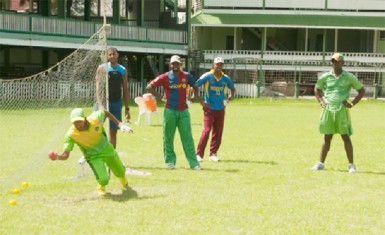 Jaguars four-day skipper Vishaul “Cheesy” Singh takes a diving catch to his right during a net session yesterday at the GCC ground. (Orlando Charles photos)