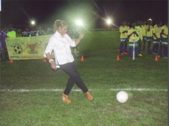 Dr Jennifer Westford performs the ceremonial kick off to declare this year’s Upper Demerara Football Association/Banks GT Beer Cup football tournament open.