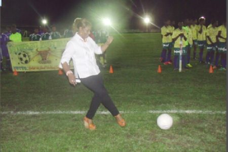Dr Jennifer Westford performs the ceremonial kick off to declare this year’s Upper Demerara Football Association/Banks GT Beer Cup football tournament open.