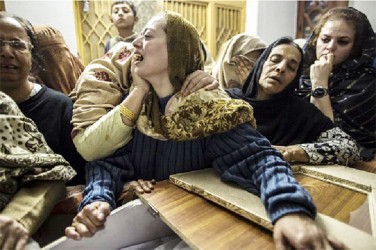 A mother mourns her son Mohammed Ali Khan, 15, a student who was killed during an attack by Taliban gunmen on the Army Public School, at her house in Peshawar December 16, 2014. REUTERS/Zohra Bensemra 