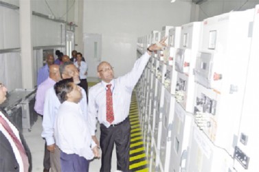 GPL’s CEO Bharrat Dindyal explaining an aspect of the sub-station at Mandela Avenue to Prime Minister Samuel Hinds (second from left) and Finance Minister Dr Ashni Singh. (GINA photo) 