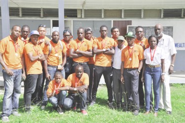 The UG Wolves rugby team posing with their spoils of the Tobago 7s.