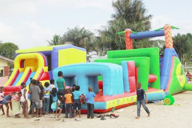 Children at Kuru Kururu form a queue to enjoy the bouncy castle (Photos courtesy of Jenelle Blackman)