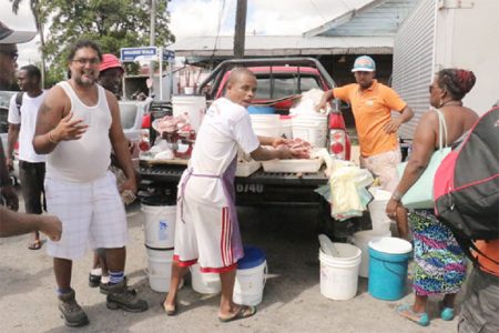 Vendors continued their sales from their vehicles outside of the Bourda Market yesterday morning. (Arian Browne photo)